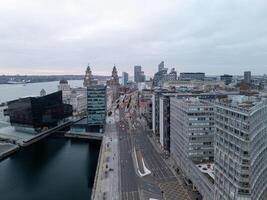 Liverpool skyline showing the three graces and the museum of liverpool at sunset photo