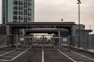 Vehicle check in area at liverpool ferry terminal showing closed barriers and signage photo