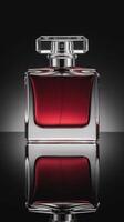Elegant Red Perfume Bottle on Dark Background photo