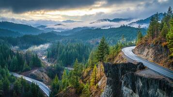 A mountain range with a winding road that leads to a cliff photo