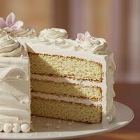 Delicious Three Layer Vanilla Cake with Buttercream Frosting and Pearl Decorations photo