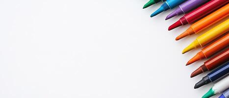 Colorful Markers Arranged on a White Background with Copy Space photo