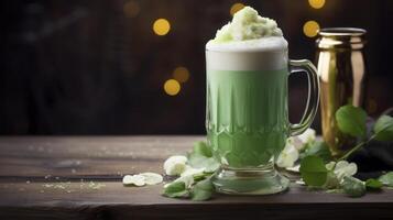 A green drink in a glass with a leaf on the table photo