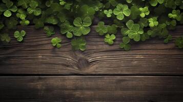 A wooden surface with green clovers on it photo
