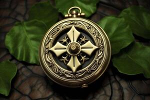 A gold and black pocket watch with a cross on it photo