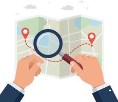 Hands holding a map with a magnifying glass exploring a route in flat illustration vector