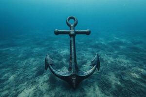 Ancient anchor rests on seafloor in crystal clear waters photo