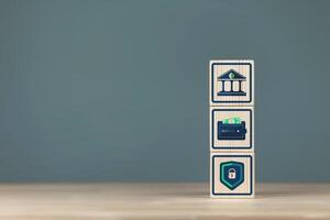 Wooden blocks with banking and security icons. Concept of financial security system photo