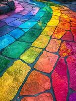 Rainbow colored stone walkway with a rainbow painted on it photo