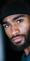 Close Up Portrait of a Bearded Man in a Black Beanie with Intense Expression photo