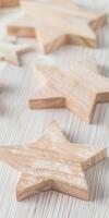 Wooden star decorations on light surface creating a minimalist aesthetic photo