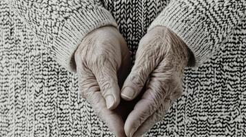 Elderly Hands in Knit Sweater Capturing Age, Texture, and Warmth in photo