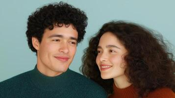 Smiling Couple with Curly Hair in Cozy Sweaters Against Soft Background photo