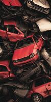 Stacked Scrap Cars Red and White Vehicles in Junkyard Contrast photo