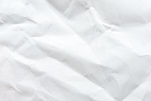 Crumpled white paper texture with folds and creases for background or design elements. photo