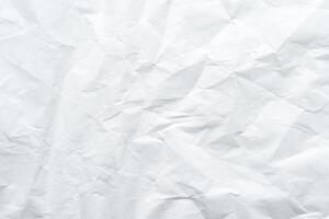 Textured crumpled white paper background with creases and wrinkles. photo