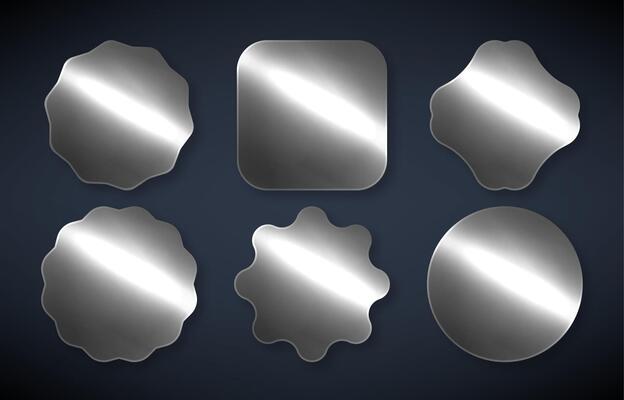 Series of silver stickers on a dark background. Silver metal Labels and Badges