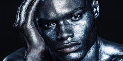 Futuristic Metallic Portrait of a Man with Silver Body Paint in Moody Lighting photo