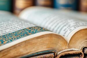 CloseUp of an Open Vintage Book with Decorative Page Edges in a Classic Library Setting photo