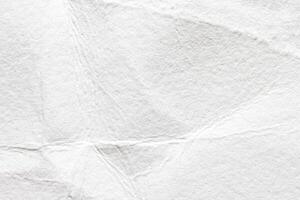 Abstract textured white paper background with creases and folds. photo