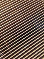 Rusty metal grate forming parallel lines creating an interesting visual pattern photo