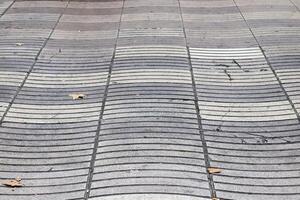 Wavy tactile paving creating an interesting urban pattern photo