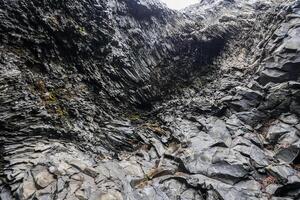 Basalt rock formation creating dramatic landscape in iceland photo