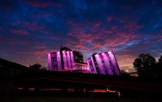 Riga, Latvia, 2024 - Modern Building with Purple Lights in Rezekne, Latvia at Dusk photo