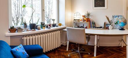 Riga, Latvia, 2024 - Cozy Home Office with Large Window and Potted Plants photo