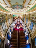 Riga, Latvia, 2024 - Aerial View of Church Interior with Ornate Ceiling and Altar photo