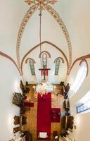 Riga, Latvia, 2024 - Aerial View of Cathedral Interior with Ornate Design and Chandelier photo