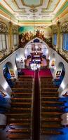 Riga, Latvia, 2024 - Aerial View of Church Interior with Decorated Ceiling and Altar photo