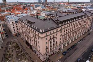 Riga, Latvia, 2024 - Aerial View of Riga Featuring St. Peters Church and Vansu Bridge photo