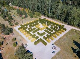 Aerial View of Geometric Hedge Maze in a Park Setting photo