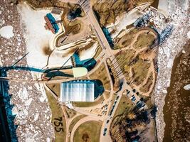 Aerial View of Park Area with Pavilion, River, and Ice Formations photo