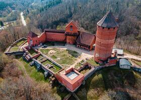 Turaida Castle and Surrounding Forested Hills in Sigulda, Latvia photo