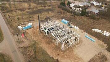 Construction Site with Steel Frame Structure and Crane in Overcast Weather photo