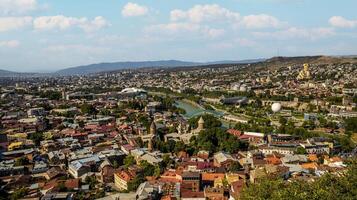Panoramic View of Tbilisi with Kura River and Sameba Cathedral photo