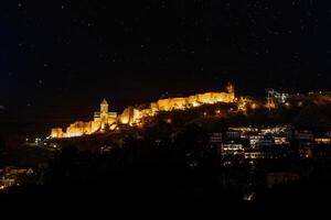 Illuminated Narikala Fortress and St. Nicholas Church at Night photo
