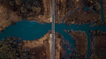 Aerial View of Railway Bridge Spanning a Winding River and Streams photo