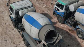Concrete mixer unloading concrete, drone view video