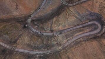 Bikers ride along a winding mountain road video