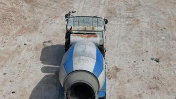 Concrete mixer unloading concrete, drone view video