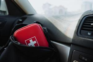 A Compact First Aid Kit stored conveniently in your cars dashboard is crucial for ensuring you have essential emergency supplies readily available for any situation photo