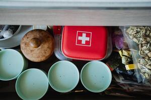 A wellorganized kitchen drawer is essential, holding a First Aid Kit, serving bowls, and snacks for quick access, ensuring convenience and efficiency in cooking photo
