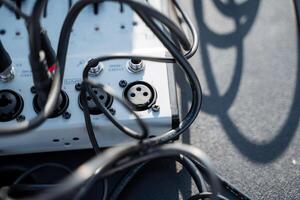 A large assortment of wires and cables are intricately connected to a sophisticated device that serves a specific purpose in the realm of technology and engineering, enhancing functionality photo
