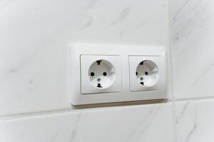 The Modern Double Power Outlet is designed for a Bathroom Setting, improving the overall appearance and convenience of the space while providing essential electricity facilities photo