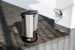 This Stainless Steel Electric Pot features a sleek exterior surface and comes equipped with a durable power cord for easy usage and connectivity during catering events photo