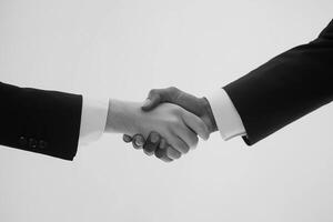 A firm handshake seals the deal, symbolizing partnership and business agreement. photo