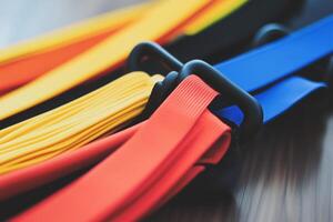 A set of resistance bands arranged in vibrant colors, ready for a workout. photo